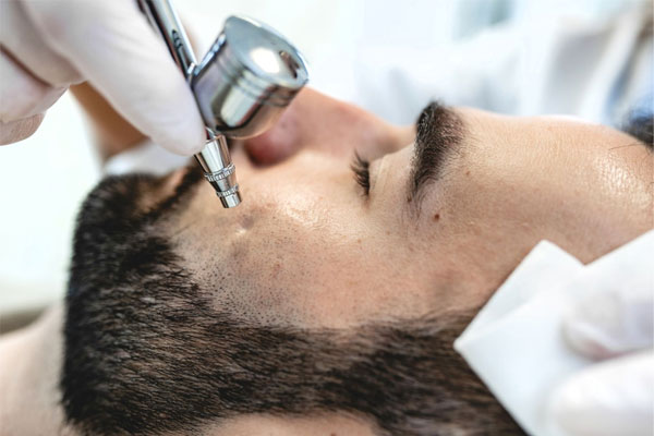 A man receives an facial skin treatment at Rejuvience Med Spa Scottsdale