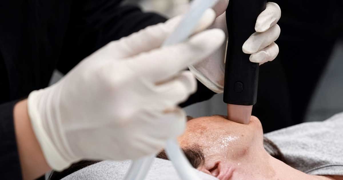 A woman receiving a DENSITY RF skin tightening treatment at Rejuvience Med Spa Scottsdale